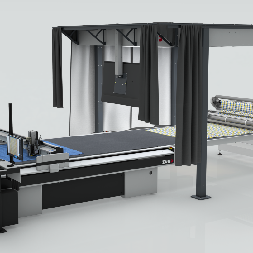 Industrial Zünd flatbed cutter with roll-fed material feed and a shielded, illuminated work area for error-free material detection
