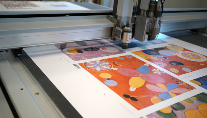 Artelo uses Zünd digital cutters to trim efficiently nested fine-art prints, ensuring consisten accuracy across varied sizes. Artelo uses Zünd digital cutters to trim efficiently nested fine-art prints, ensuring consistent accuracy across varied sizes.
